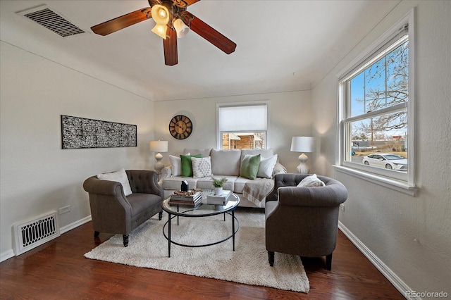 living area with a wealth of natural light, wood finished floors, and visible vents