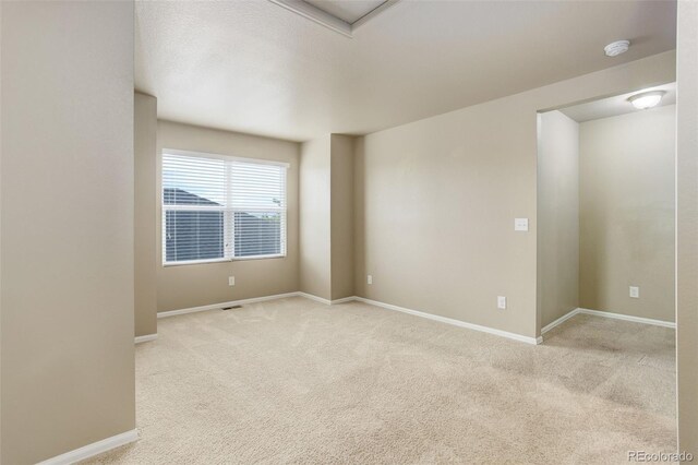 467 S 36th Ave, Brighton, CO 80601 - spare room featuring light colored carpet, baseboards, and a smoke detector