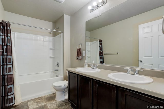 467 S 36th Ave, Brighton, CO 80601 - bathroom with shower / bath combo with shower curtain, double vanity, toilet, and stone finish floors