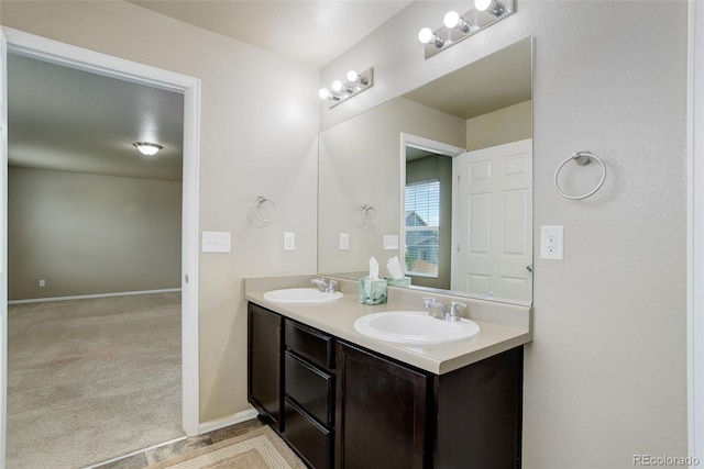 467 S 36th Ave, Brighton, CO 80601 - full bath featuring double vanity and baseboards