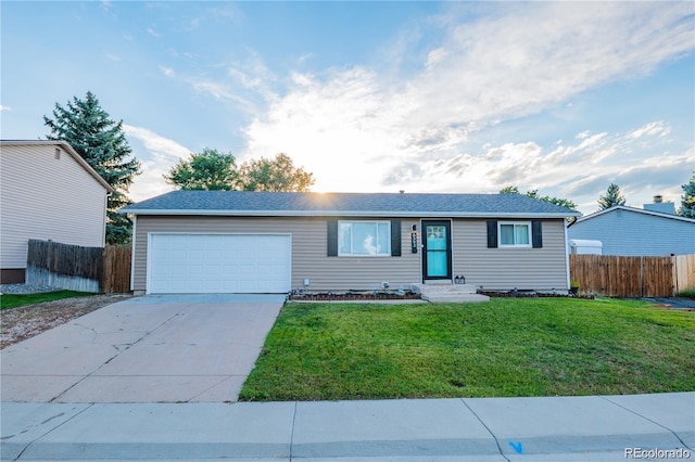 ranch-style house with an attached garage, fence, a front lawn, and concrete driveway