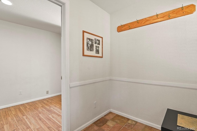 28730 Mountain View Rd, Conifer, CO 80433 - hall with baseboards and wood finished floors