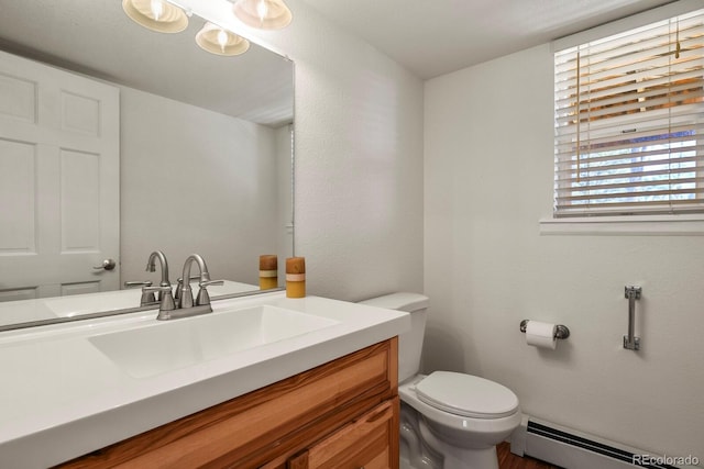 bathroom featuring vanity, toilet, and a baseboard radiator