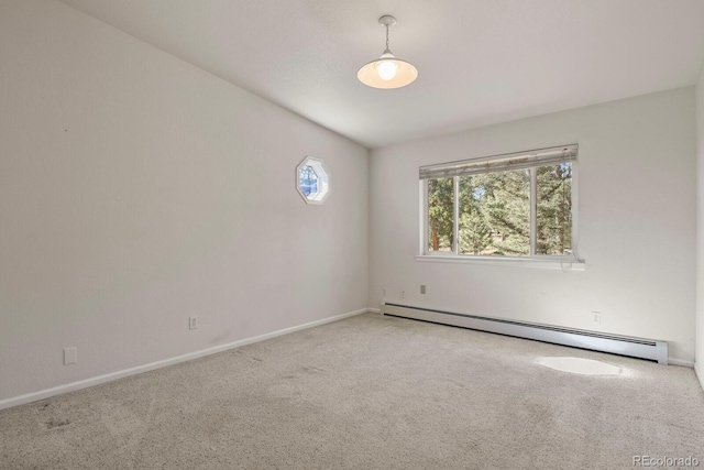 carpeted empty room with baseboard heating