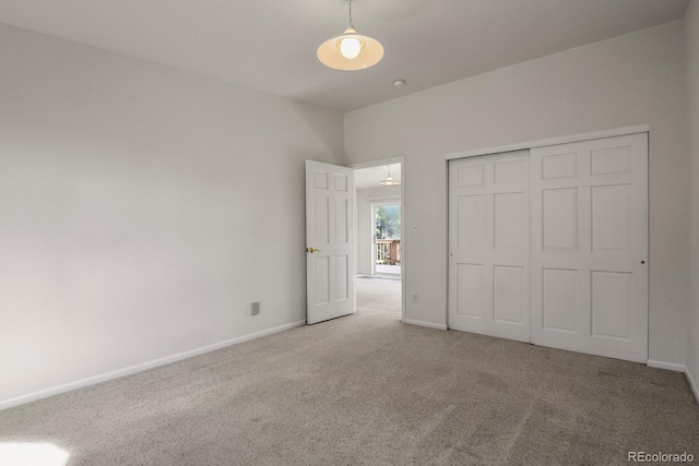 unfurnished bedroom featuring a closet and carpet