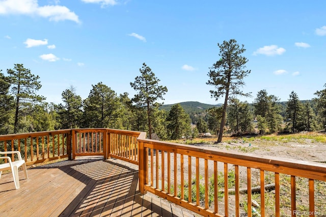 wooden terrace featuring a mountain view