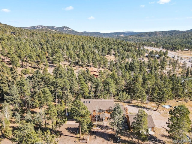 28730 Mountain View Rd, Conifer, CO 80433 - drone / aerial view of a heavily wooded area and a mountainous background