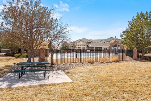 5735 N Genoa Way Unit 11-205, Aurora, CO 80019 - view of property's community with a patio area, a yard, and fence