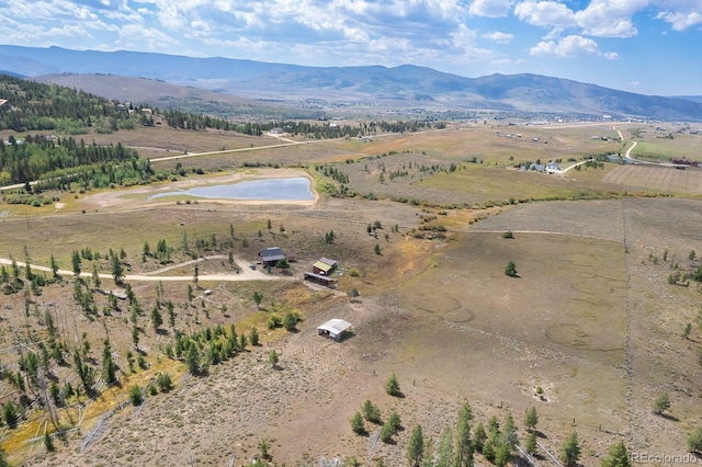 aerial view with a mountain view and a rural view