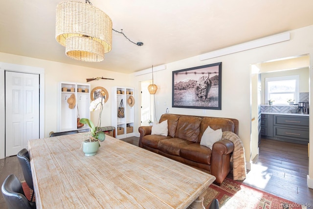 dining room featuring dark hardwood / wood-style floors and a notable chandelier