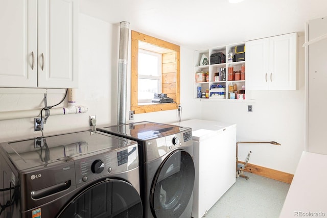 laundry area featuring independent washer and dryer and cabinets