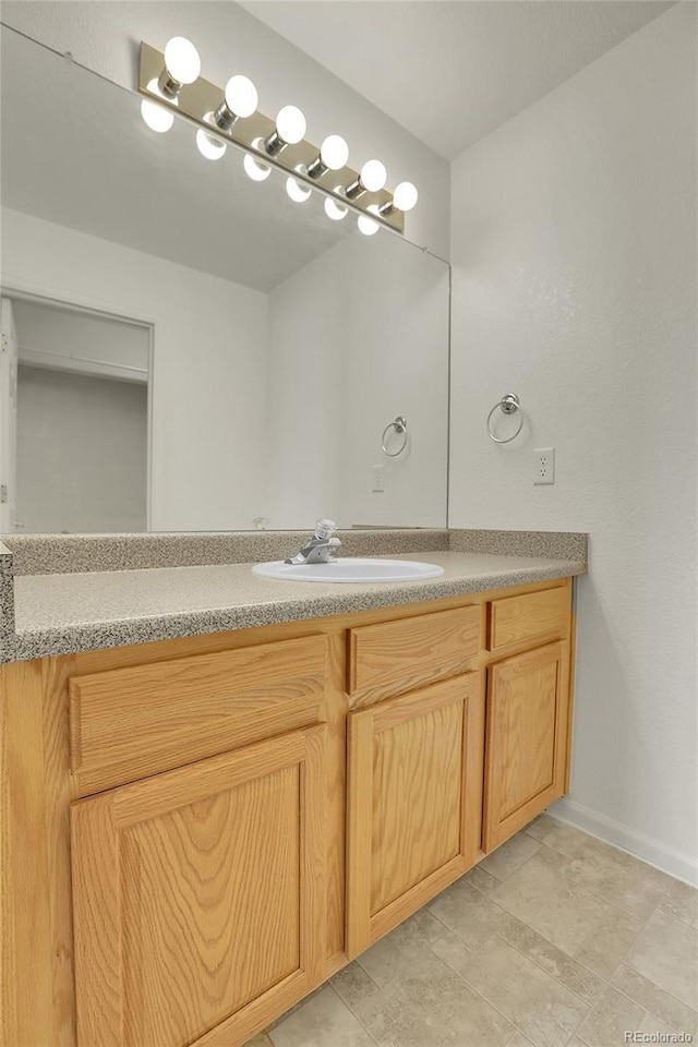 bathroom featuring vanity and baseboards