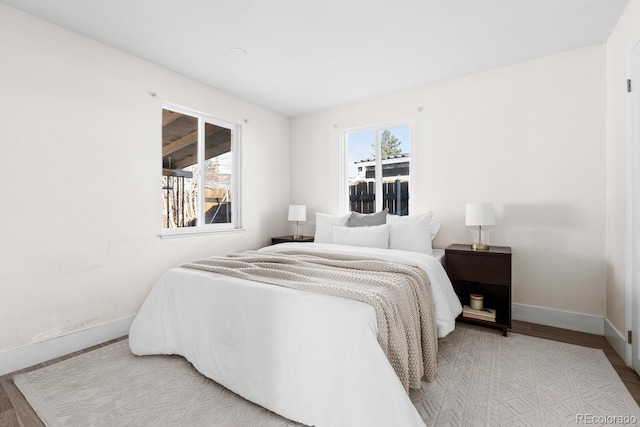 bedroom with light wood-type flooring