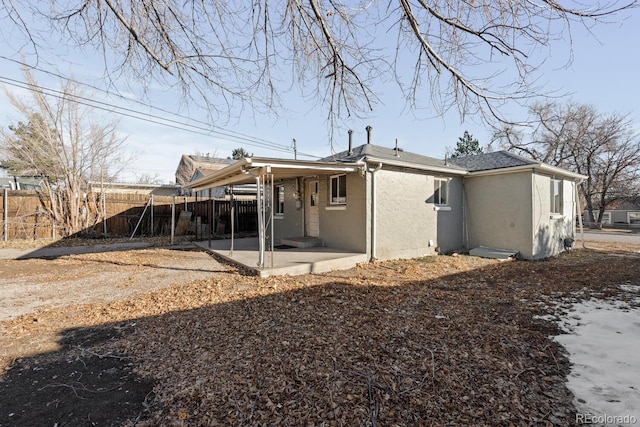 rear view of house featuring a patio