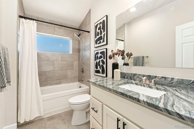 bathroom featuring toilet, tile patterned flooring, shower / bath combo, and vanity