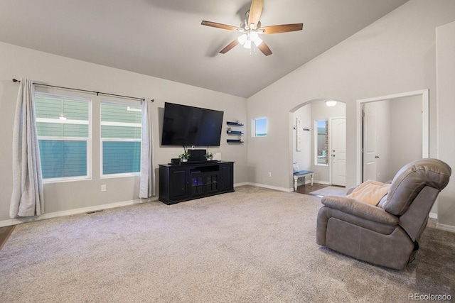 living room with carpet, ceiling fan, and high vaulted ceiling