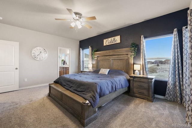 carpeted bedroom featuring ceiling fan and ensuite bathroom