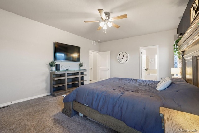 carpeted bedroom with ceiling fan and ensuite bath