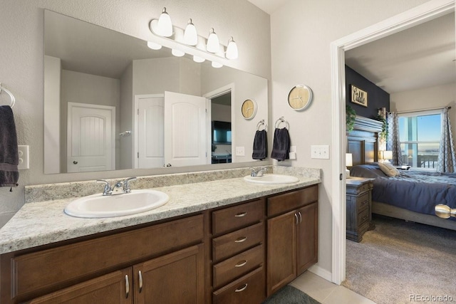 bathroom with tile patterned flooring and vanity