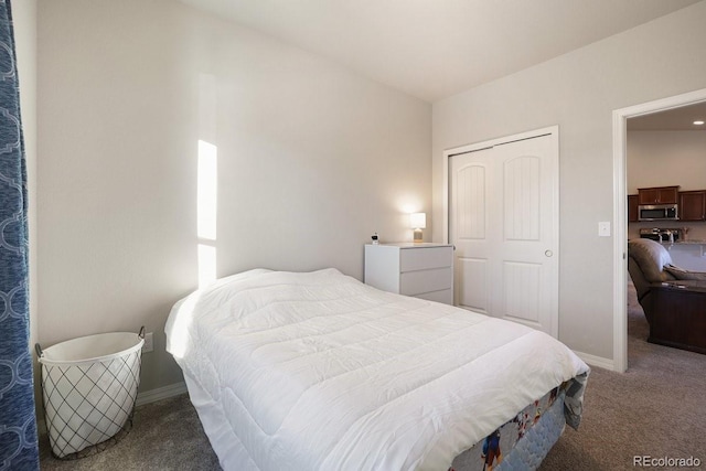 carpeted bedroom with a closet