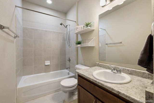 full bathroom with vanity, tiled shower / bath combo, toilet, and tile patterned flooring