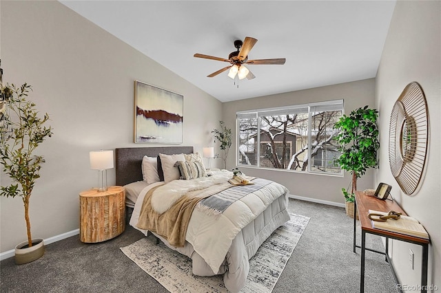 carpeted bedroom featuring ceiling fan, baseboards, and vaulted ceiling