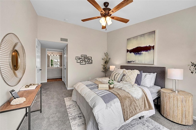 bedroom featuring ensuite bathroom, ceiling fan, carpet floors, visible vents, and baseboards