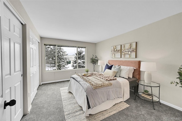 bedroom with carpet and baseboards