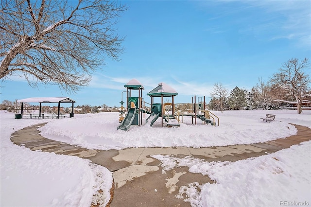 snow covered playground with a playground