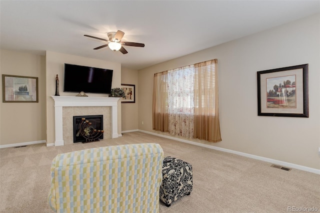 12513 Grape St, Thornton, CO 80241 - living room featuring carpet floors, a ceiling fan, and a fireplace