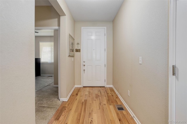 12513 Grape St, Thornton, CO 80241 - doorway featuring baseboards and light wood-type flooring