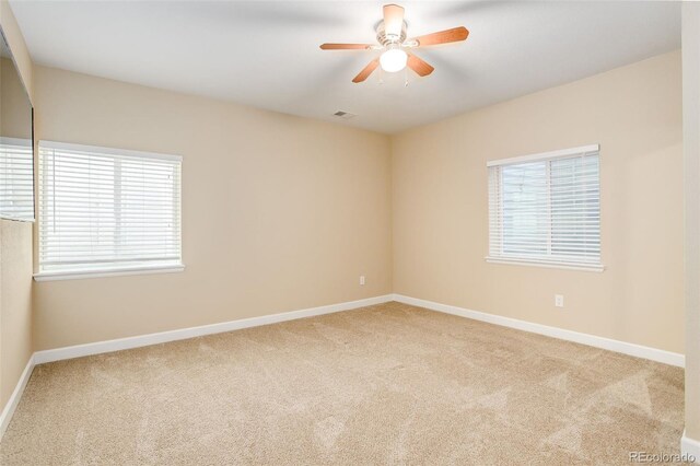 12513 Grape St, Thornton, CO 80241 - empty room featuring plenty of natural light, carpet floors, and a ceiling fan