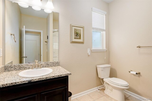 12513 Grape St, Thornton, CO 80241 - bathroom with vanity, tile patterned floors, and a shower