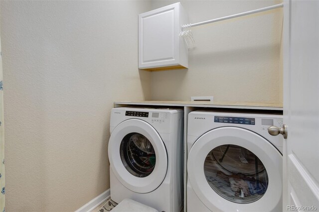 12513 Grape St, Thornton, CO 80241 - laundry area featuring washing machine and clothes dryer and cabinet space