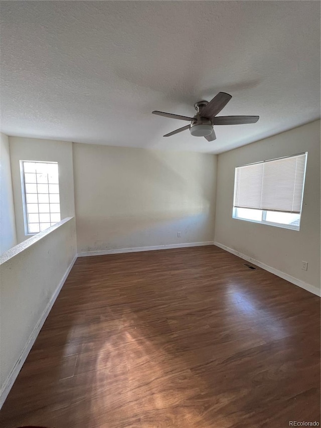 4361 Argonne St, Denver, CO 80249 - spare room featuring wood finished floors, ceiling fan, and a textured ceiling