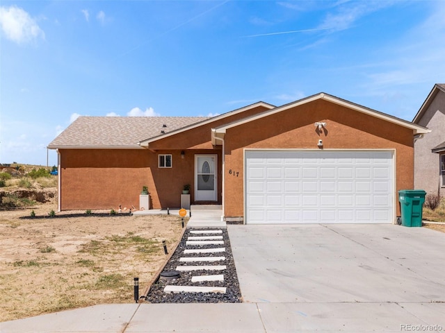 single story home featuring a garage