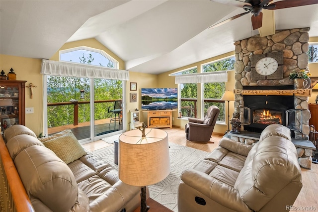 7260 Remington Rd, Como, CO 80432 - living area featuring a ceiling fan, lofted ceiling, a fireplace, and light wood-style floors