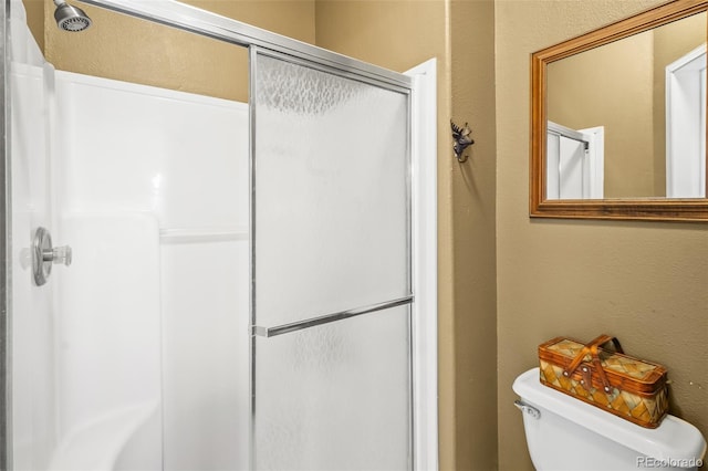 7260 Remington Rd, Como, CO 80432 - bathroom with a stall shower, toilet, and a textured wall
