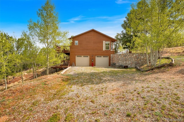 7260 Remington Rd, Como, CO 80432 - view of side of home featuring an attached garage and a deck