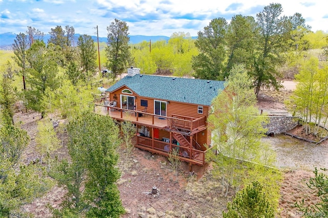 7260 Remington Rd, Como, CO 80432 - rear view of house featuring a deck, faux log siding, and roof with shingles
