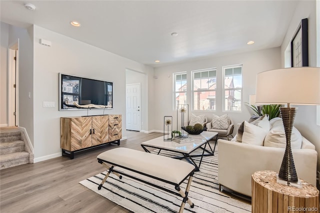 6581 E 148th Dr, Thornton, CO 80602 - living room with light wood-type flooring, recessed lighting, and stairs
