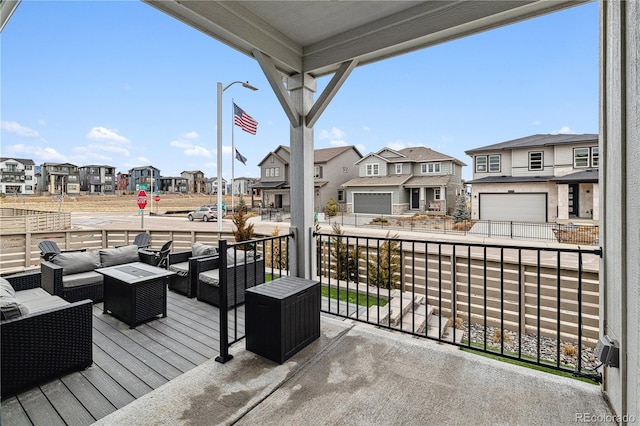 wooden deck with a residential view and an outdoor hangout area
