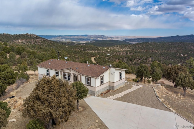 birds eye view of property with a mountain view