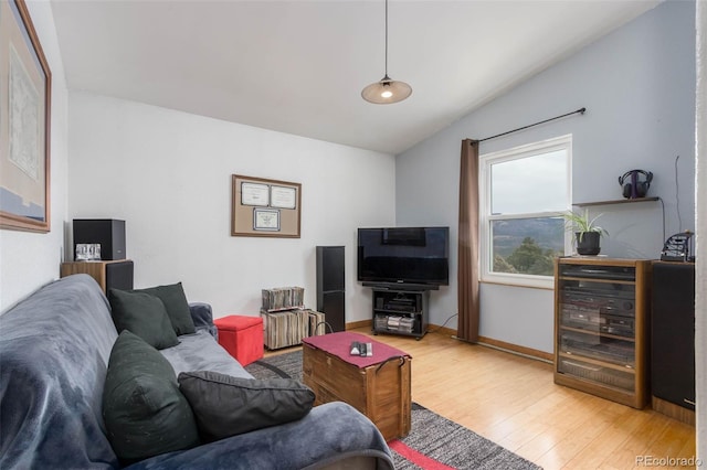 living room featuring hardwood / wood-style flooring and lofted ceiling