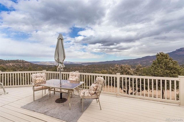 wooden deck featuring a mountain view