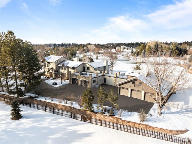 snowy aerial view featuring a residential view