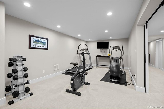 exercise area with recessed lighting, baseboards, visible vents, and carpet
