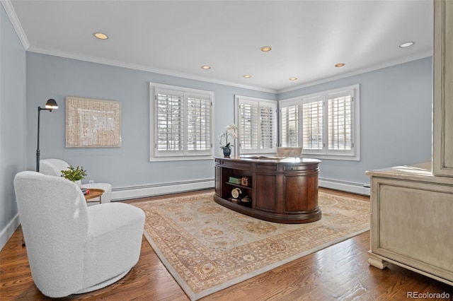 office area with crown molding, a baseboard heating unit, and a healthy amount of sunlight