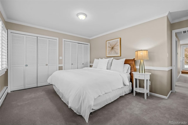 bedroom featuring visible vents, baseboards, two closets, ornamental molding, and carpet flooring