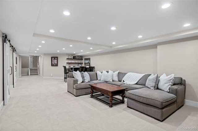 living area with baseboards, recessed lighting, and light colored carpet
